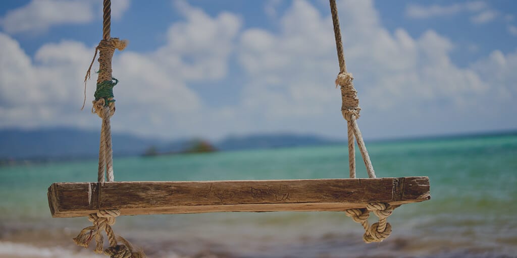 handmade bench in front of the ocean, signifying trust
