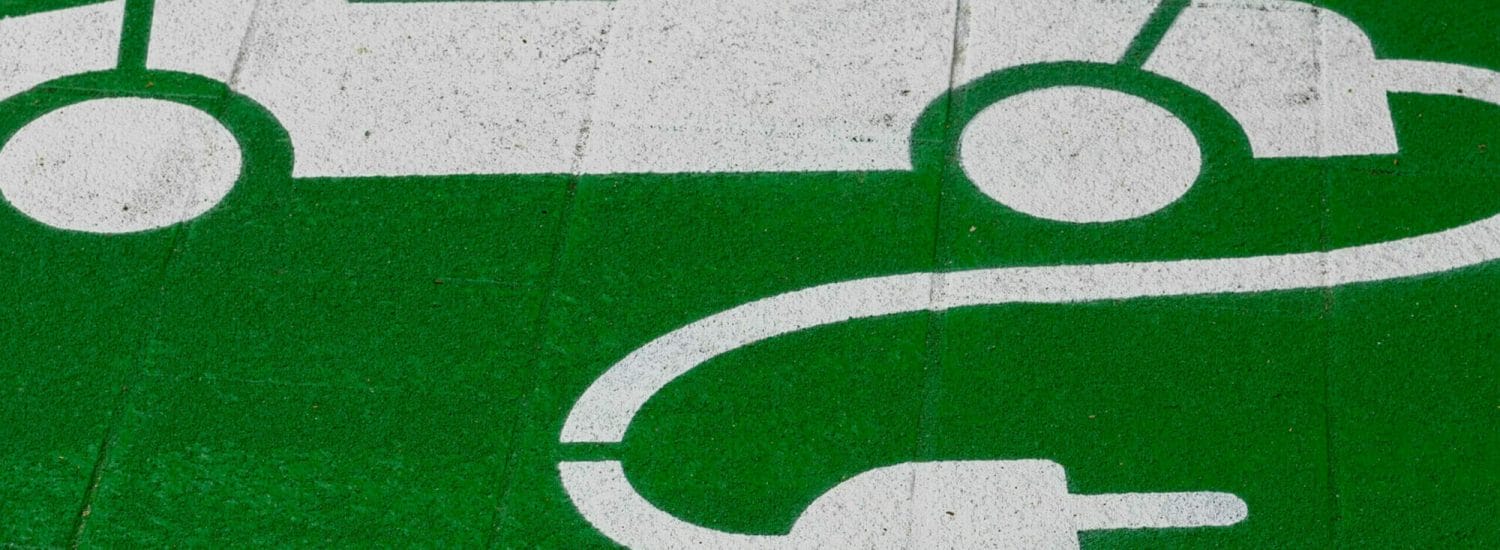 Image of an electric car charging station logo.