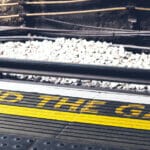 "Mind the Gap" warning painted in yellow on the ground at the London Underground