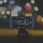 Image of iPhone recording short-form video content at night.