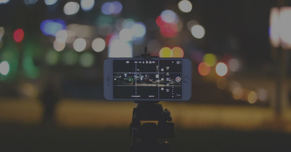 Image of iPhone recording short-form video content at night.