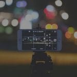 Image of iPhone recording short-form video content at night.