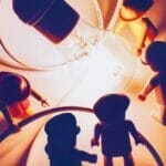 A team of Lego people being enlightened by a light bulb