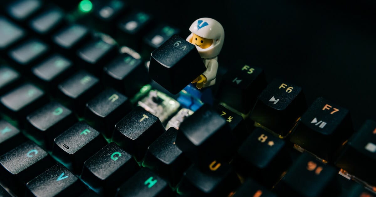 A little LEGO figure helping to repair a computer keyboard