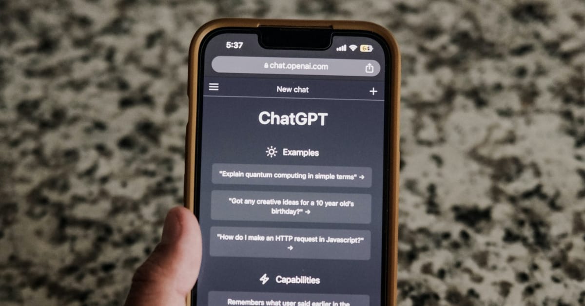 A person’s hand holding a phone with the ChatGPT app open, reflecting the importance of AI in an omnichannel approach