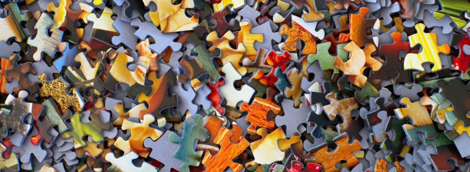 multicolor puzzle pieces in a pile