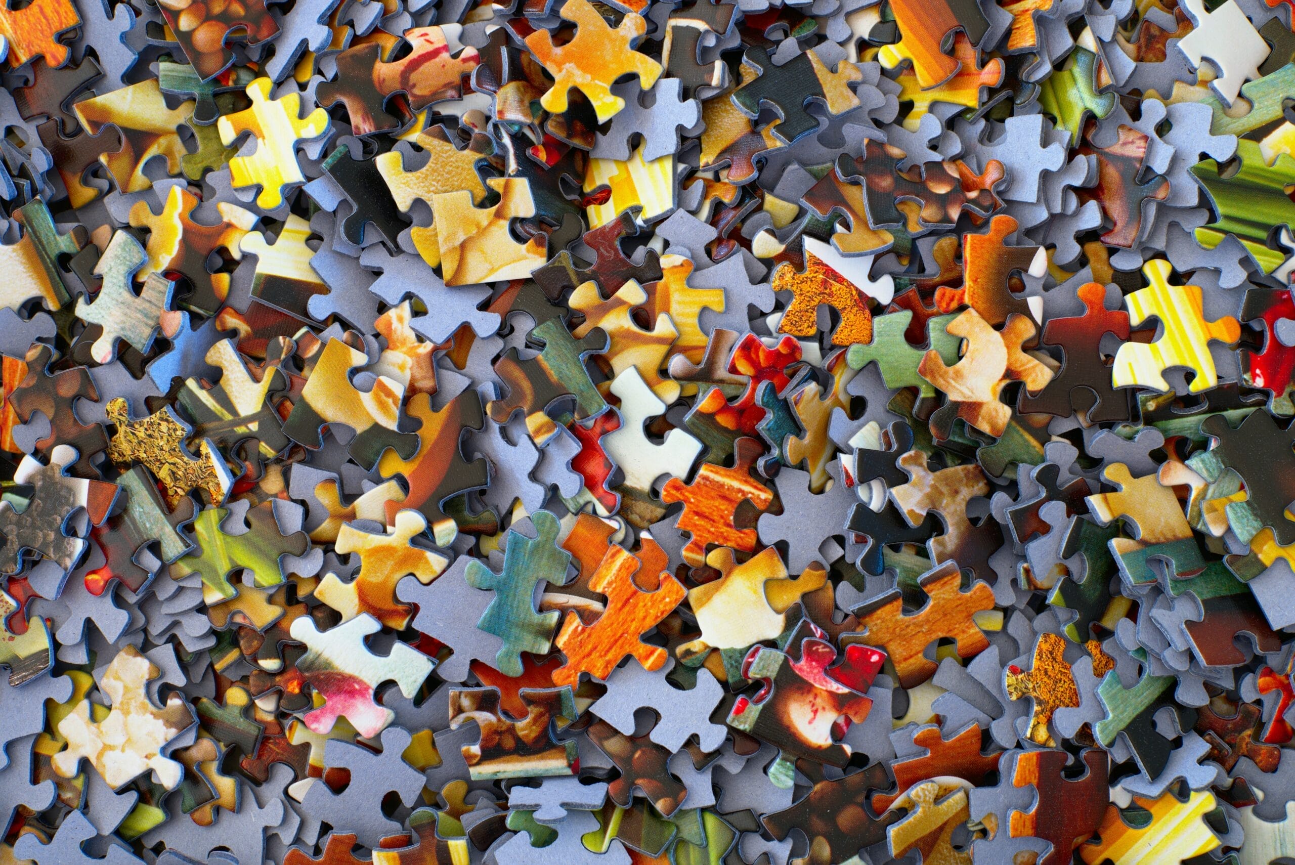 multicolor puzzle pieces in a pile