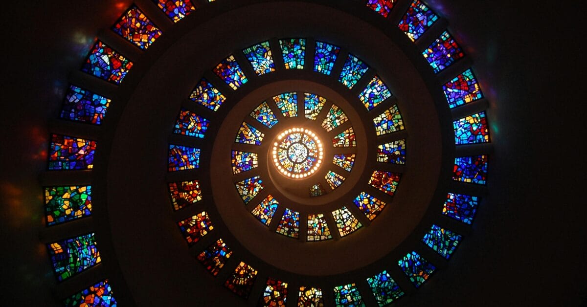 stained glass windows in a circular pattern, signifying executive visibility